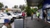 FILE - Customers queue outside a Western Sydney chemist to purchase Rapid Antigen Test kits in the wake of the coronavirus disease (COVID-19) pandemic in Sydney, Australia, Jan. 5, 2022.