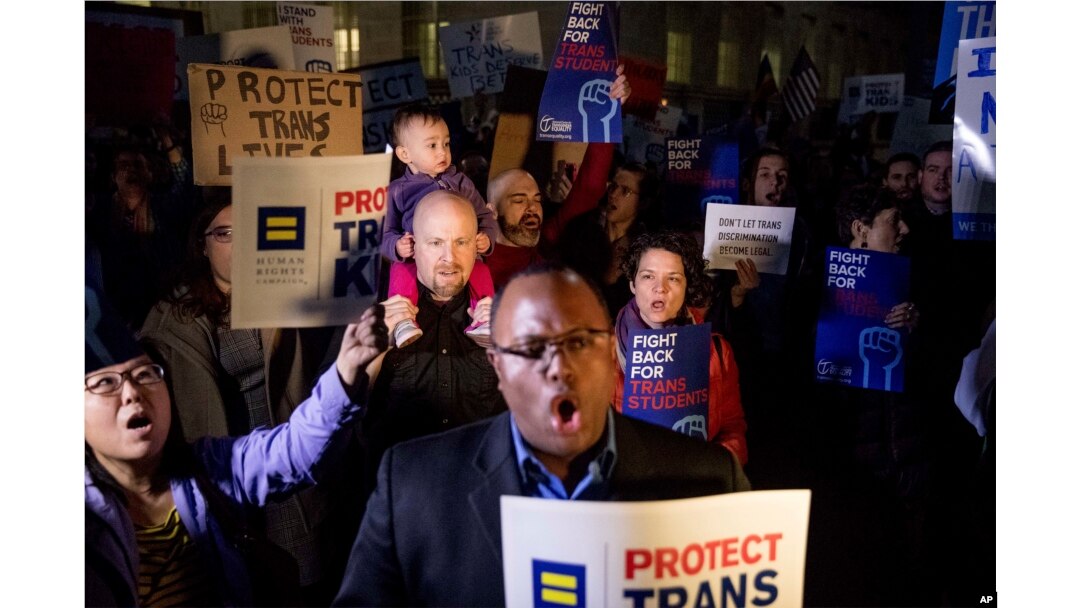 Activists and protesters with the National Center for Transgender Equality rally in front of the White House, Feb. 22, 2017 after President Trump announced he would revoke guidelines for protecting transgender students.
