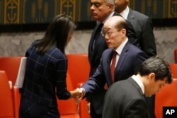 U.S. Ambassador to the United Nations Nikki Haley speaks to China's U.N. Ambassador Liu Jieyi after a vote to adopt a new sanctions resolution against North Korea during a meeting of the U.N. Security Council, Sept. 11, 2017.