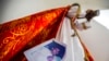 An image of Bishop Rolando Alvarez is pinned to a robe on a statue of Jesus Christ at the Cathedral in Matagalpa, Nicaragua, Aug. 19, 2022. 