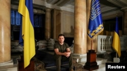 Ukrainian President Volodymyr Zelenskyy poses after an interview with Reuters in Kyiv, Ukraine, March 1, 2022. 