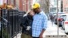 Maria and her fiancé, David, pose for a photograph near their Chicago home on March 4, 2022. 