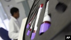 FILE - Blood is tested at the AIDS Care Training and Support Initiative at White River Junction, South Africa. The center has received funds from the President's Emergency Plan for AIDS Relief (PEPFAR).