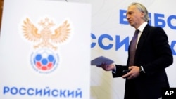 FILE - Alexander Dyukov, head of the Russian Football Union, walks after a press conference in Moscow, Russia, Feb. 22, 2019.