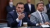 Republican Congressman Mike Gallagher, left, speaks at the Capitol, in Washington, Aug. 30, 2021. Gallagher is leading a new House Select Committee on China. 