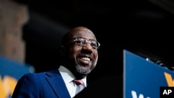 FILE - Sen. Raphael Warnock, D-Ga., speaks during a rally on Dec. 1, 2022, in Atlanta. Warnock is running against Republican Herschel Walker in a runoff election. 