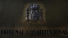 FILE - A plaque is seen at the entrance of Spain's Constitutional Court building in Madrid, Sept. 6, 2017.
