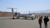 FILE - Passengers board the Ethiopian Airlines plane at the Lalibela Airport in Lalibela town of the Amhara Region, Ethiopia, Jan. 27, 2022. The national carrier announced that it will resume daily flights to Tigray region's capital Mekelle on Dec. 28, 2022.