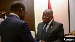 Ghana's President Nana Akufo-Addo, right, greets Benin's President Patrice Talon during bilateral meetings at the Accra Initiative regional security conference in Accra, Ghana, Nov. 22, 2022.