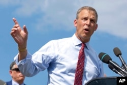 FILE - Rep. Scott Perry, R-Pa., takes a question from a reporter, on Capitol Hill in Washington, Aug. 23, 2021.