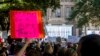 FILE - People attend the Women's March ATX rally, Oct., 2, 2021, at the Texas State Capitol in Austin, Texas. 