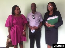 Purity Moyo, her husband Jeffrey Moyo and attorney Kathleen Mpofu are seen at Bulawayo Magistrate Courts in Zimbabwe, March 15, 2022. (Photo courtesy of Jeffrey Moyo)