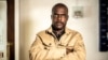 FILE - Freelance journalist for the New York Times, Jeffery Moyo, poses for a photograph after his release from detention at the Bulawayo prison in Bulawayo, Zimbabwe, June 16, 2021.