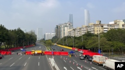 Barriers form a security checkpoint in the Haizhu district in Guangzhou in southern China's Guangdong province Nov. 11, 2022.