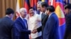 U.S. President Joe Biden greets other leaders during the 2022 ASEAN summit in Phnom Penh, Cambodia, November 12, 2022. 
