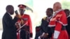Tanzania's President-elect John Magufuli (L) takes the Oath of Office during his inauguration ceremony at the Uhuru Stadium in Dar es Salaam, Nov. 5, 2015. 