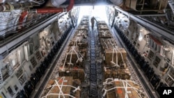 A C-17 cargo aircraft is loaded with 155 mm shells and fuses, ultimately bound for Ukraine, April 29, 2022, at Dover Air Force Base, Del.