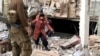 A child emerges from the Azovstal steel plant during UN-led evacuations after nearly two months of siege warfare on Mariupol, Ukraine, by Russia, in this still image from a video released May 1, 2022. Credit: David Arakhamia/Azov Regiment/Handout via REUT