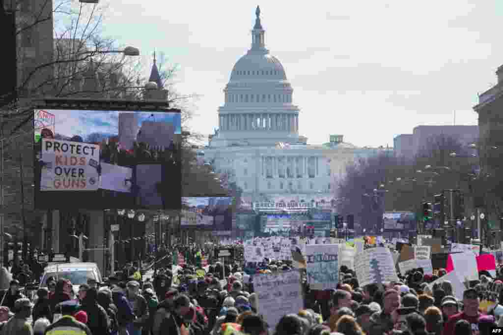 Participants take part in the "March for Our Lives" rally in Washington, DC on March 24, 2018.