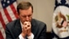 FILE: U.S. Senator Chris Murphy of Connecticut listens during a press conference, April 19, 2022.