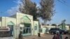 A woman leaves Mame Abdou Aziz Sy Dabakh Hospital in Tivaouane, Senegal where 11 newborns died in a fire Wednesday night. (Annika Hammerschlag/VOA)