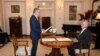 Australia's new Prime Minister Anthony Albanese (L) takes an oath in front of Australia's Governor General David Hurley (R) at Government House in Canberra on May 23, 2022.