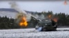 In this handout photo taken from video and released by Russian Defense Ministry Press Service on Jan. 13, 2023, a Russian self-propelled 152.4 mm howitzer Msta fires on a mission at an undisclosed location in Ukraine. 