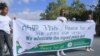 FILE - Girls hold a banner in support of the recent peace deal agreed between the Ethiopian federal government and Tigray forces, at an event in Mekele, the capital of Ethiopia's Tigray region, Nov. 26, 2022. African officials will be monitoring the deal's implementation.