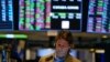 US Stocks Sink as Fed Signals It Will Remain Aggressive 