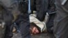 Polisi menahan seorang aktivis selama aksi protes menentang perluasan tambang lignit terbuka Garzweiler milik utilitas RWE Jerman, di Luetzerath, Jerman, Rabu 11 Januari 2023. 