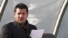 FILE - Former Iran's national soccer team coach Ali Daei before a match in Tehran, Jan. 14, 2009. Daei says his wife and daughter departed from Tehran, legally before the flight made an unannounced stop on Kish Island in the Persian Gulf, where they were questioned.