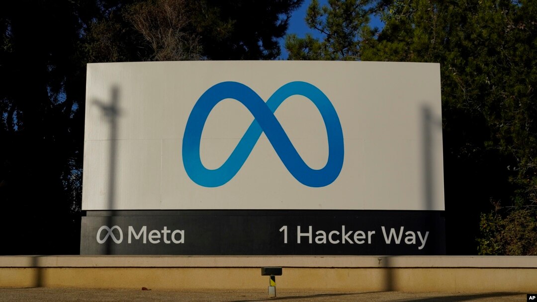 Meta's logo can be seen on a sign at the company's headquarters in Menlo Park, Calif., Nov. 9, 2022. Meta, which is Facebook's parent company, announced it is laying off 11,000 people, about 13% of its workforce.