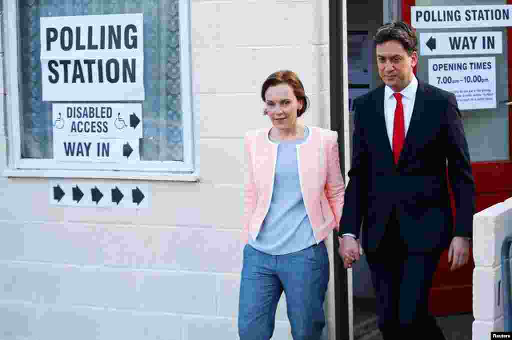 Britain's opposition Labor Party leader Ed Miliband leaves after voting with his wife Justine in Doncaster, May 7, 2015.