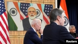 U.S. President Joe Biden, seated with Secretary of State Antony Blinken and India's Foreign Minister Subrahmanyam Jaishankar holds a videoconference with India's Prime Minister Narendra Modi to discuss Russia's war with Ukraine from the White House, Apr. 