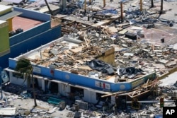 Business are seen in the wake of Hurricane Ian, in Fort Myers Beach, Florida, Sept. 29, 2022.