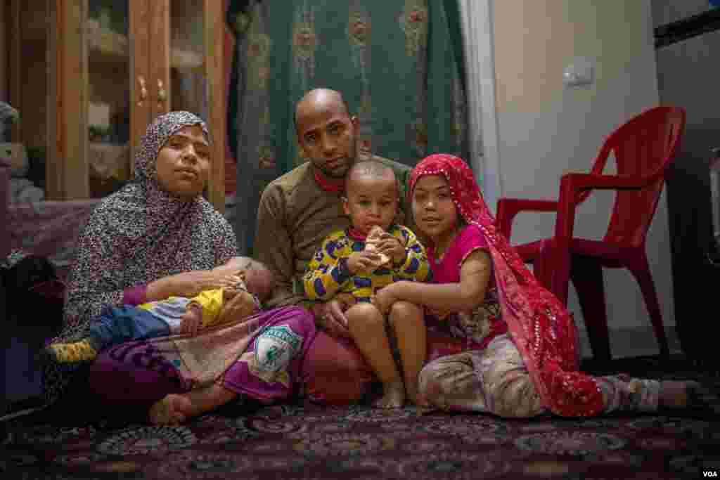 Tarek Mostafa and his family are among Egypt’s tens of millions of poor, saying they can now barely afford state subsidized housing. “Our living expenses are very high here,” he says, “and I haven't found a new job yet.” Cairo, April 5, 2022. (Hamada Elra
