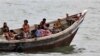 Burmese Rohingya Muslims fleeing religious violence are intercepted by Bangladesh border authorities, Taknaf, Bangladesh, June 13, 2012.