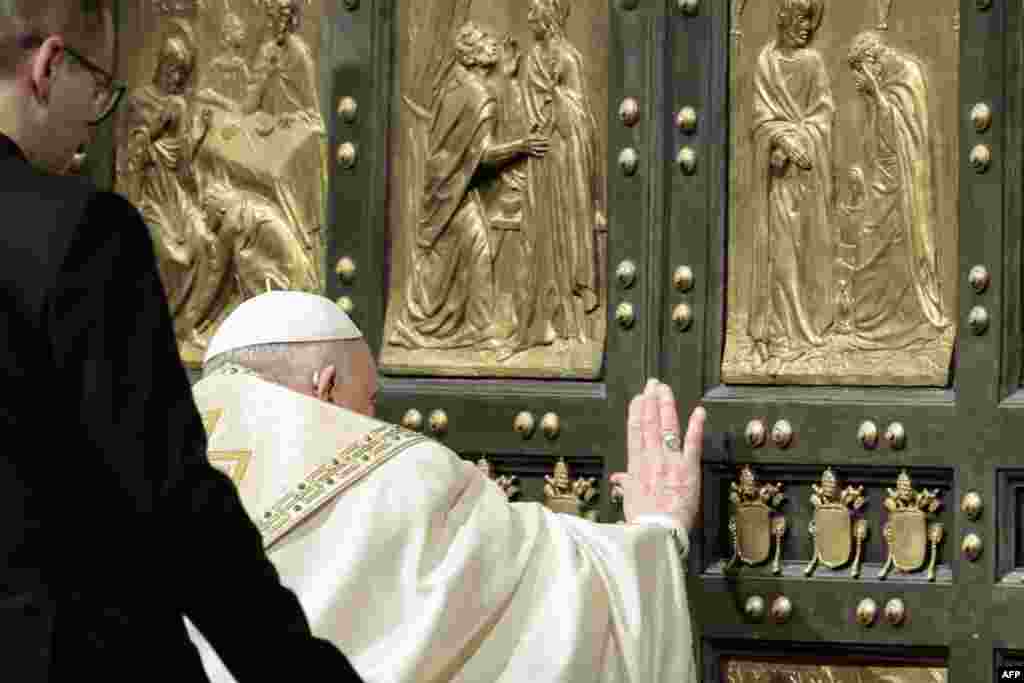 Pope Francis opens the Holy Door of St Peter's Basilica, during a special ceremony to mark the launch of the Jubilee 2025, a year of Catholic celebrations set to draw more than 30 million pilgrims to Rome, at the Vatican, Dec. 24, 2024.