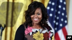 FILE - First lady Michelle Obama speaks at the White House.