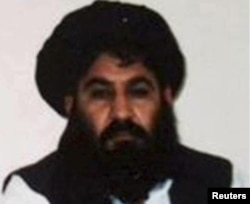 FILE - Mullah Akhtar Monsour, leader of the Afghan Taliban, is seen in this undated handout photo from the Taliban.