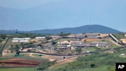 FILE - A Sept. 28, 2012, photo shows the private homestead of South African President Jacob Zuma in Nkandla, in the northern KwaZulu Natal province South Africa. Zuma using taxpayer money for upgrades to the compound embroiled him in an earlier scandal over misuse of funds.