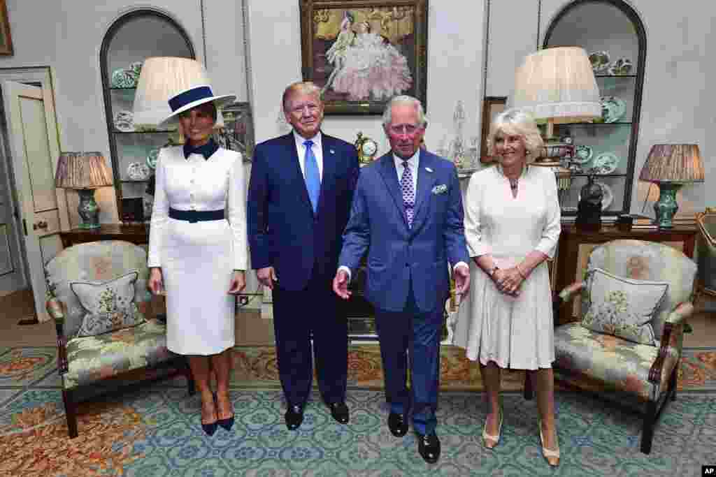 U.S. President Donald Trump and his wife Melania, left, pose for a photo with Britain's Prince Charles and Camilla, the Duchess of Cornwall prior to afternoon tea at Clarence House, in London, June 3, 2019.
