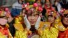 Performers wait for their turn to go onto the stage at the Longtan park as the Chinese Lunar New Year, which welcomes the Year of the Monkey, is celebrated in Beijing, China, Feb. 9, 2016. 