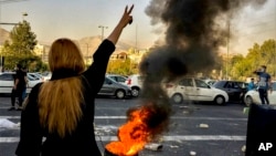 FILE - In this photo taken by an individual not employed by the Associated Press and obtained by the AP outside Iran, Iranians protest the death of Mahsa Amini, 22, after she was detained by the country's morality police, in Tehran, Oct. 1, 2022.