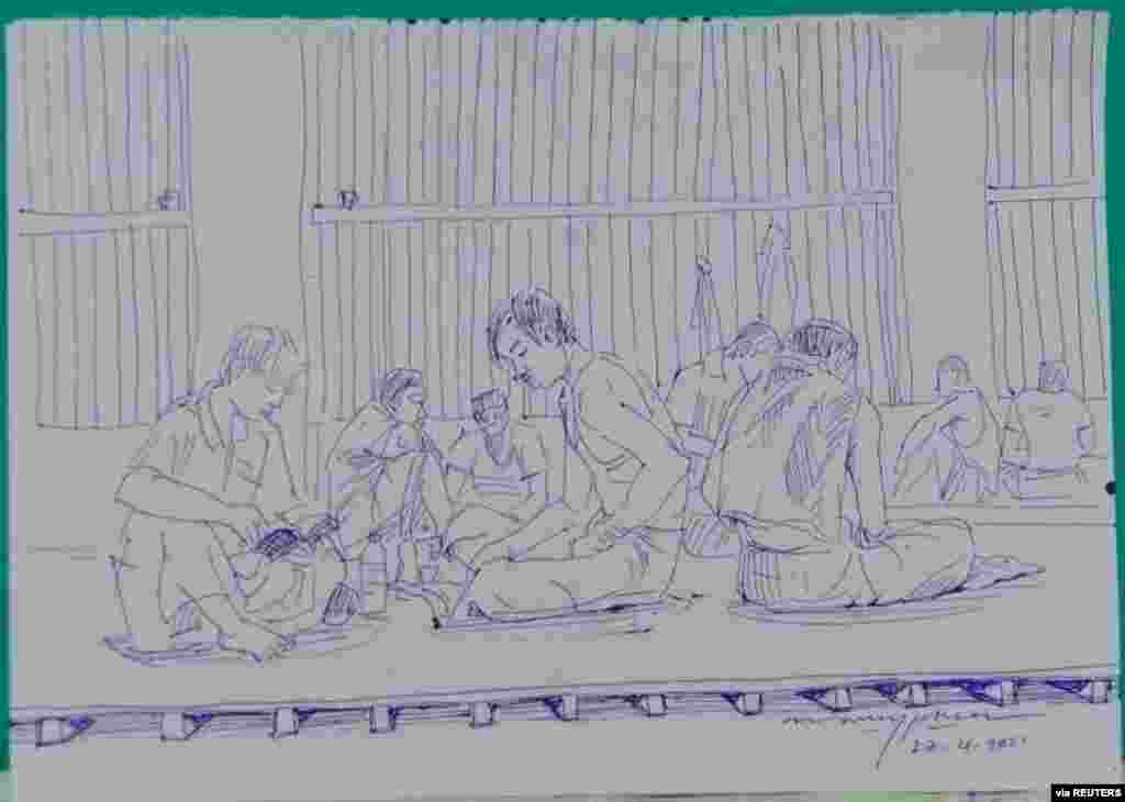 MYANMAR-POLITICS/PRISON -A smuggled sketch shows people inside of Myanmar's Insein prison with a written date April 17, 2021, in this undated picture obtained by REUTERS