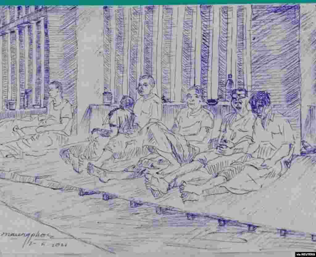 MYANMAR-POLITICS/PRISON -A smuggled sketch shows people inside of Myanmar's Insein prison with a written date April 17, 2021, in this undated picture obtained by REUTERS