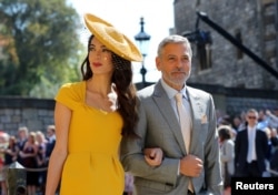 Amal Clooney and George Clooney arrive at St George's Chapel at Windsor Castle for the wedding of Meghan Markle and Prince Harry, May 19, 2018.