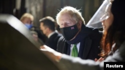 British Prime Minister Boris Johnson looks on during a visit at St. Sophia's Cathedral in Kyiv, Ukraine Feb. 1, 2022.