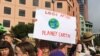 FILE - Protesters demanding action on climate change gather at Te Ngakau Civic Square in Wellington, New Zealand, March 15, 2019. 
