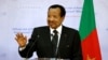 FILE - Cameroon's President Paul Biya gestures as he takes part in a joint press conference with France's President at The Presidential Palace in Yaounde, on July 26, 2022.